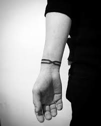 Top 43 Black Band Tattoo Ideas 2020 Inspiration Guide Wrist Tattoos For Guys Black Band Tattoo Band Tattoo Designs