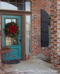 With its ornate trim and brick facade, this exterior has distinctly traditional character. Painting Exterior Shutters Sonya Hamilton Designs Painted Front Doors Turquoise Door Painting Shutters