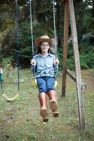 Relax in the shade on a beautiful new porch swing from sears. Preteen Girl In Cowgirl Costume Swings On Backyard Swing Set By Carleton Photography