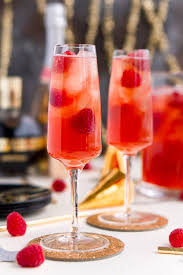 New Year S Eve Champagne Punch Is Loaded With Triple Sec Blackberry Brandy Chambord Pineapple Jui In 2020 Champagne Punch Recipes Punch Recipes New Years Eve Drinks