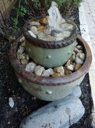 Here's a fun collection of backyard fountains. 35 Diy Fountains