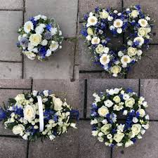 However, it is acceptable to send flowers the day after the funeral in addition to your donation to convey your sympathy and best wishes. Custom Bespoke Blue Funeral Flowers Tribute Wreath Funeral Flowers Funeral Flower Arrangements Flower Arrangements