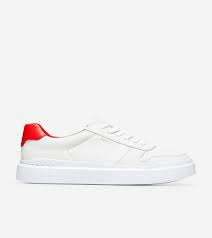 With nearly 80 years in the business and hundreds of points of distribution in the. Women S Grandpro Rally Court Sneaker In Optic White Flame Cole Haan