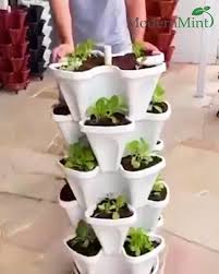 Indoorgarden or outdoorgarden?this stackable flower pot could be place anywhere.no height restristion. Flower Tower Vertical Stacking Plant Pots In 2021 Plants Diy Garden Projects Garden Projects