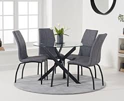The chairs are constructed from wood and offer plum seating with a stunning high back design for comfort. Mara 100cm Round Glass Dining Table With Antique Noir Chairs