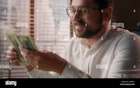 Guy money hi-res stock photography and images