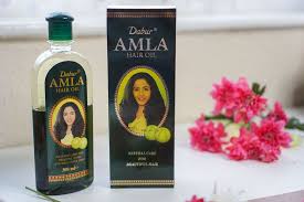 This oil nourishes the scalp and strengthens the hair strands, from root to tip, to give you thick, long & shiny tresses. 4 Reasons To Start Putting Amla Oil In Your Hair How To Do It Just Jiha In 2021 Amla Oil Castor Oil For Hair Growth Amla Hair Oil