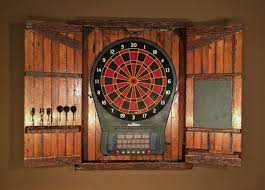 First we'll go over some basic information and features that you need to keep an eye out for when it comes to electronic dart boards, you're likely going to find a bit more variation since electronic dart boards are rarely ever used in professionally regulated dart events. Rustic Large Electronic Dartboard Cabinet With Chalkboard Home And Living Made To Order Dart Board Cabinet Dartboard Cabinet Diy Barn Wood