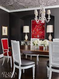In The Dining Room High Impact Paisley Wallpaper Deep Gray Walls And Bold Red Flourishes Make A Statement Grey Dining Grey Dining Room Dining