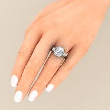 Two round cut side stones accompany a prominent cushion cut center stone in silvertone prong setting. Celebrity Engagement Rings Meghan Markle Engagement Ring With A Gem Quality Cushion White Sapphires All Sapphires