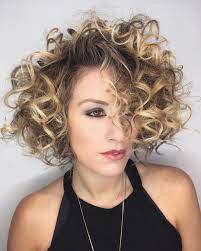 Shaped Bob With Large Messy Spiral Curls And Blonde Balayage Hair Color The Latest Hairstyles For Men And Women 2020 Hairstyleology Bob Haircut Curly Bob Hairstyles Curly Hair Styles
