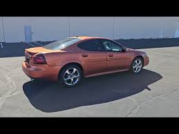 Image result for Sunburst Orange 2004 Pontiac