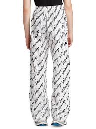 Shop Balenciaga New Scribble Logo Pajama Pants Saks Fifth Avenue