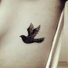 Small Blackbird On Ribs Tattoo Idea Phoenix Tattoo Design Tattoos Rib Tattoo Ideas