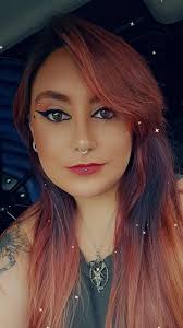 Can someone remove my earrings from this photo for a professional headshot?