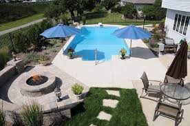 These outdoor fire pit ideas can help you create a backyard or patio you will enjoy. Pool And Fire Pit Fire Pit Backyard Backyard Fire Backyard Pool