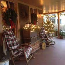 Pin By We Hang Christmas Lights On Porches Christmas Porch Decor Christmas Porch Porch Decorating