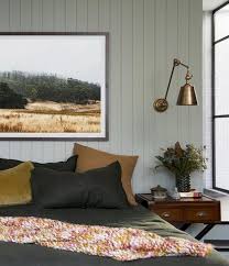 The walls, rug and sofa cover the room with a sage hue that makes the whole space feel relaxing. Fall Color Trends 8 Harvest Inspired Hues To Embrace This Autumn Green Bedroom Walls Feature Wall Bedroom Home Decor Bedroom