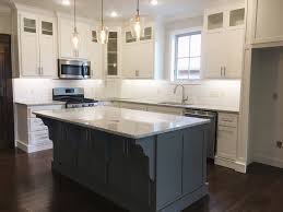 A lovely, fresh and simple kitchen makeover featuring light grey cabinets with a classic farmhouse sink and butcher. Farmhouse Kitchen With Painted Cabinets Sherwin Williams Pure White Repainting Kitchen Cabinets Painting Kitchen Cabinets Sherwin Williams Pure White Cabinets