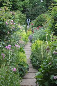 A View Through The Rose Garden Towards Angel A Sculpture By Pete Moorhouse Rose Garden Landscape Garden Inspiration Cottage Garden