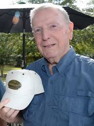 A World War II veteran leads the parade, along with his guests from Germany