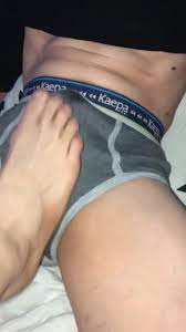 Dude gets a great footjob through boxers until he cums - ThisVid.com