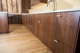 These cabinets work well with a medium color pallet and offer a slightly more formal look. Hand Crafted Claro Walnut Kitchen Cabinets By Jason Straw Custom Furniture And Cabinets Custommade Com