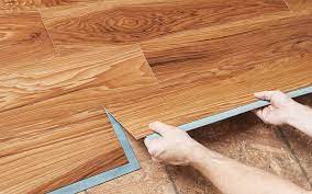 A Person Installing A Grip Strip Vinyl Plank Over A Plywood Subfloor Installing Vinyl Plank Flooring Vinyl Plank Flooring How To Install Vinyl Plank Flooring
