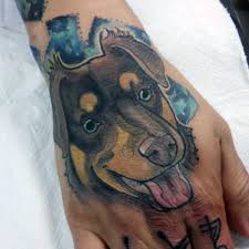 Since ancient times, the great war chiefs and other famous men decorated their bodies with dog face portrait tattoo on hand, telling of their exploits and changing social status. Cartoon Like Painted And Colored Little Dog Portrait On Hand Tattooimages Biz