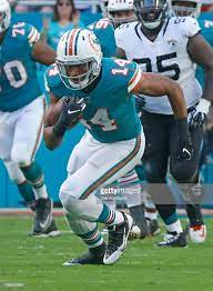 Bryce Petty Of The Miami Dolphins Runs With The Ball Against The Miami Dolphins Football Dolphins Football Miami Dolphins
