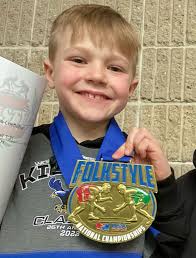 Team South Dakota wrestlers win divisions in USA Wrestling event.