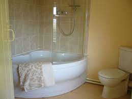 Pheasant Cottage Corner Bath With Independent Shower Unit Http Rigsbywoldholidaycottages Uk Corner Tub Shower Combo Corner Tub Shower Corner Bathtub Shower