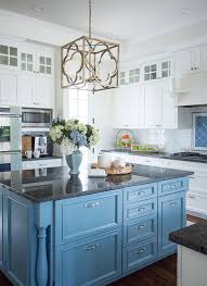 This kitchen uses ceiling to floor white cabinets that flow into a black and white marble backsplash, giving the impression of a larger space. Beach Inspired Home With Blue And White Kitchen Home Bunch An Interior Design Luxury Homes Blog Kitchen Remodel Kitchen Renovation Kitchen Inspirations