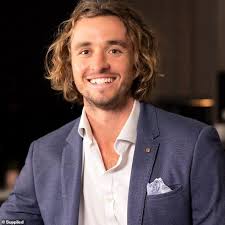 Real estate boss Jonathan Bell is charged with drink driving after four-car  pile-up injured a pregnant woman and destroyed his $400,000 Lamborghini SUV  in Brisbane