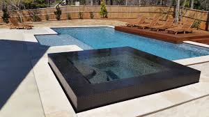 Modern Pool With Tile Infinity Edge Spa Modern Pools Modern Pool And Spa Luxury Swimming Pools