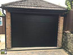 Roller Shutter Garage Door In Black Garage Doors Garage Door Design Garage Door Cost