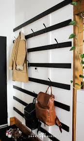 This tutorial will show you how to build a modern coat rack. Building A Giant Minimalist Coat Rack The Sorry Girls Diy Coat Rack Home Decor Accessories Home Diy