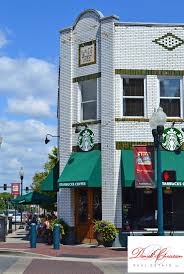 There Are Starbucks Everywhere But The Downtown Franklin Starbucks Has A Unique Decor Thanks To Its Location In A Whit White Building Real Estate House Styles
