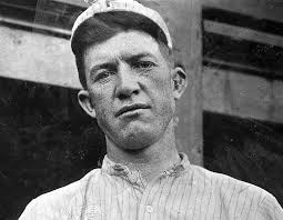 When did the Yankees adopt their iconic pinstripes?