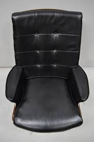 Heywood wakefield wicker sewing stand antique appraisal. Vintage Heywood Wakefield Teak And Black Vinyl Swivel Tilt Lounge Armchair At 1stdibs