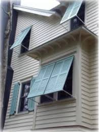 These exterior shutters are cut so that they properly conceal the lower arched windows. 18 Beach House Shutters Ideas House Exterior House House Shutters