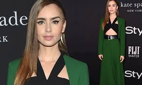 Lily Collins flashes midriff in black bodysuit with emerald skirt and  blazer for InStyle Awards | Daily Mail Online