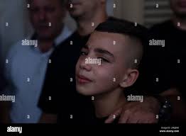 Mohammed, brother of Fares Abu Samra, 14, cries during his funeral in the  West Bank city of Qalqilya, Thursday, July 27, 2023. The Palestinian Health  Ministry said Thursday that Abu Samra was