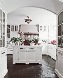 Terra Cotta Tiles Were Updated Rather Than Replaced With A Few Fabulous Coats Of Chocolate Hued Paint Painted Floors Design Kitchen Flooring
