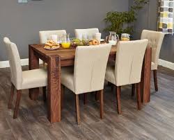 This Stylish 4 To 6 Seater Solid Dining Table Is Designed With Large And Chunky Legs It Has A Modern De Large Dining Table 6 Seater Dining Table Dining Chairs