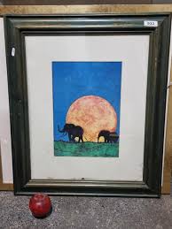 A print of a painting originally by the artist Tony Sharp showing two  elephants silhouetted against