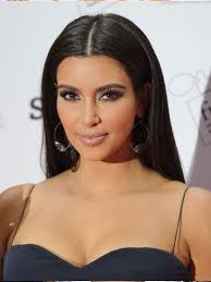 Kim Kardashian With A Sleek Middle Part Kim Kardashian Makeup Looks Kim K Makeup Makeup Looks