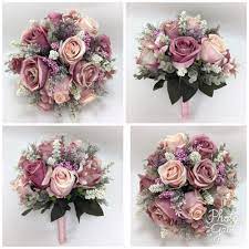 Eucalyptus berries, dusty miller leaves and silver brunia berries are also scattered throughout. Artificial Silk Flower Dusty Pink Roses Cream Lavender Bridal Wedding Bouquet Queenslandaustralia Wedding Bridal Bouquets Bridal Bouquet Bridal Bouquet Sets