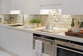 Oversize subway tiles installed in a brick pattern with light gray grout add dimension to this streamlined space. White Kitchen Brick Backsplash Modern Kitchen Backsplash Diy Kitchen Backsplash Brick Backsplash Kitchen