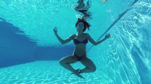 Newslow motion of young beautiful woman splashing water in swimming pool. 7 059 Woman Swimming Underwater Stock Videos Royalty Free Woman Swimming Underwater Footage Depositphotos